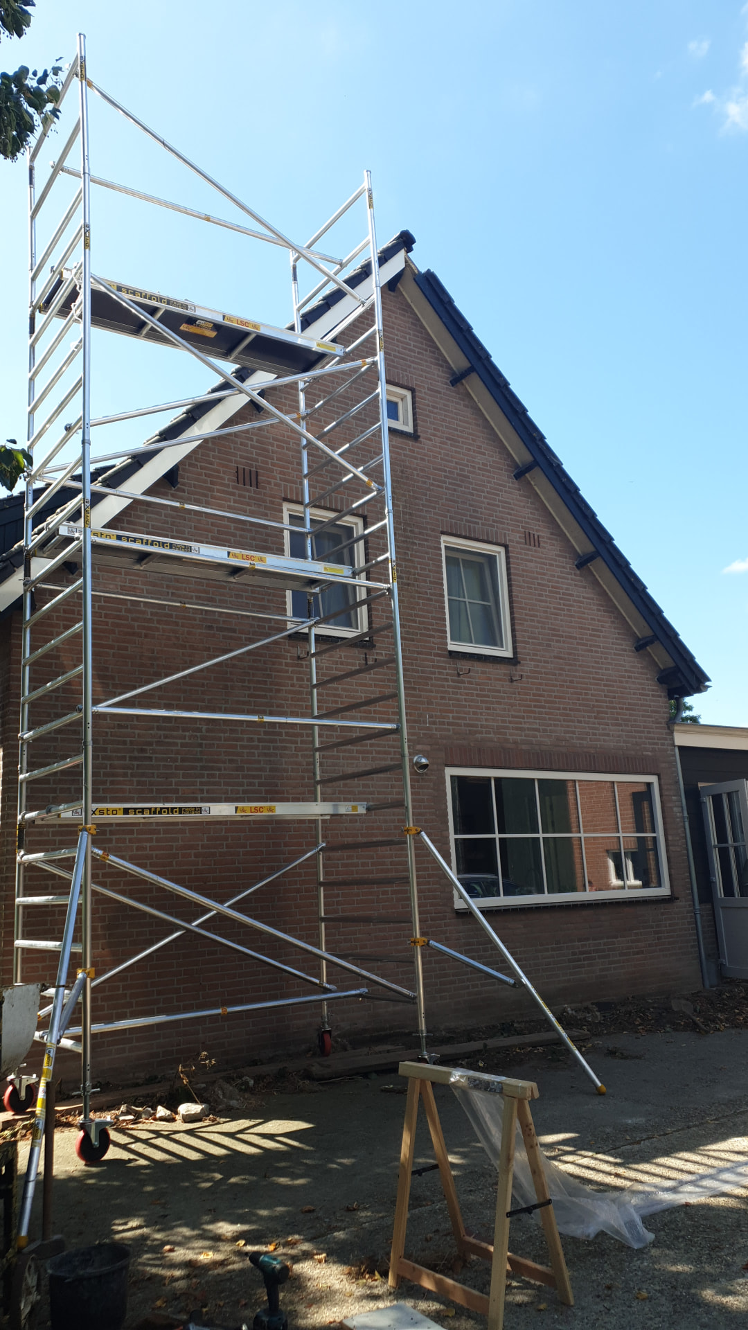 Buitenschilderwerk op hoogte foto 3