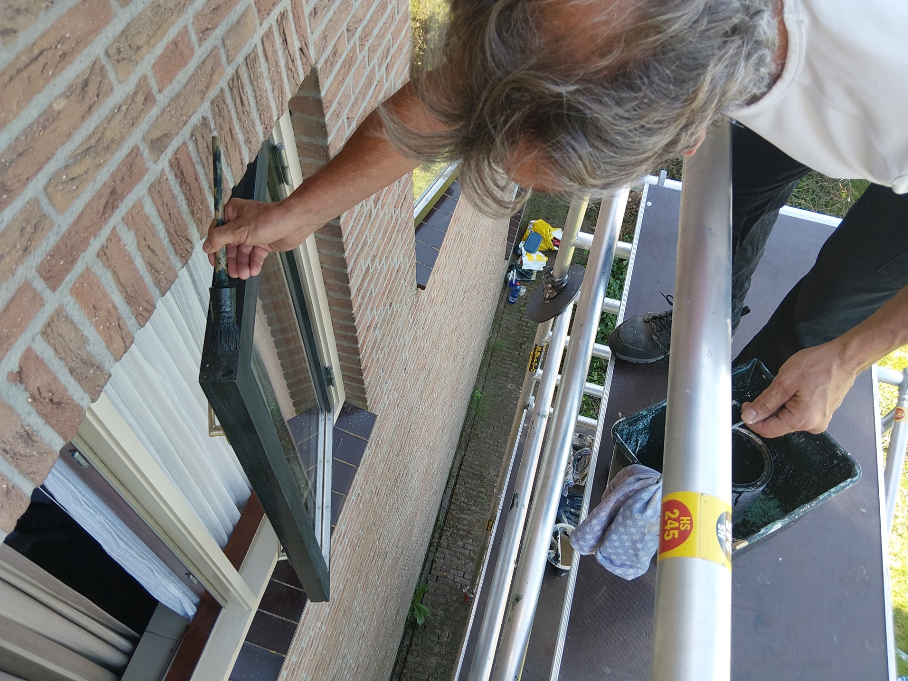 Buitenschilderwerk op hoogte foto 4